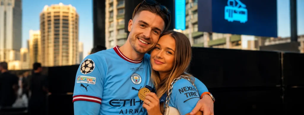 Kiera Grealish Biography, Career —And Life Beyond Her Famous Brother Manchester City forward Jack Grealish smiling and embracing his younger sister, lifestyle influencer Kiera Grealish, during a stadium football trophy victory celebration.