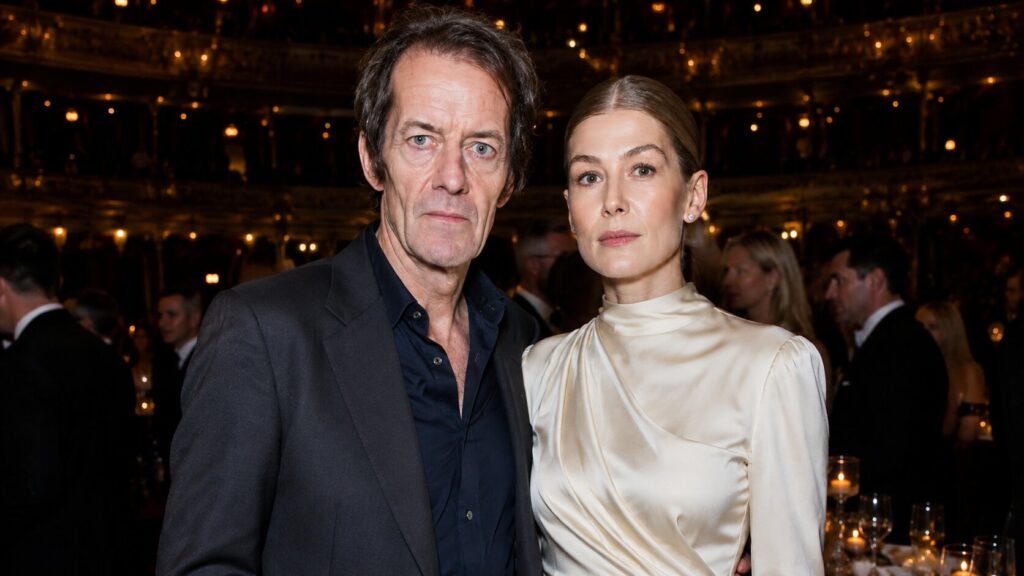 Robie Uniacke and actress Rosamund Pike posing together during a formal evening event.